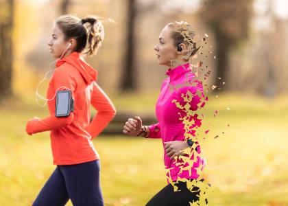 Two people running outdoors. One has stylized holes in their body to represent lack of energy sufficiency.