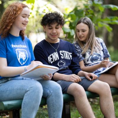 Students talking on bench